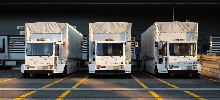 Three white trucks