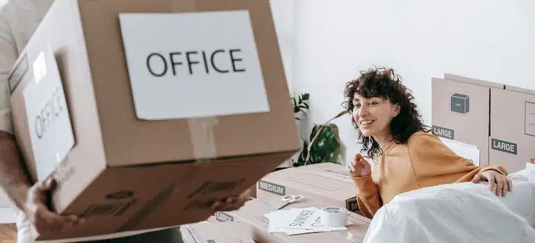 women receiving parcel from office