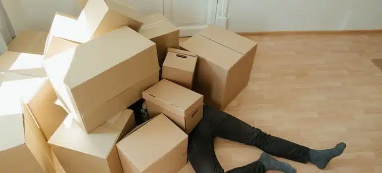 A man beneath the boxes