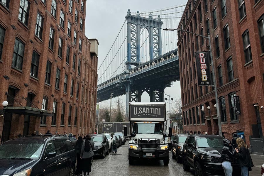 U.Santini moving truck in front of the Manhattan Bridge