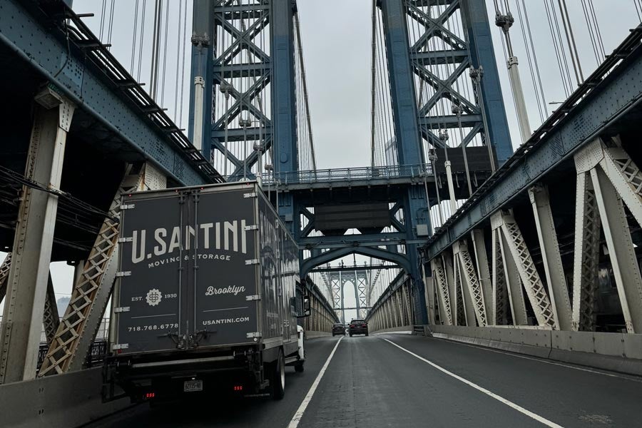 U.Santini truck crossing bridge into NYC